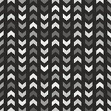 Tile vector pattern with grey and black arrows on black background