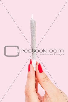 Woman holding joint.