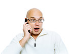 Bald man emotionally communicates by phone. Isolated. Studio