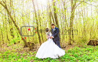 Bride and groom having a romantic moment on their wedding day outdoor