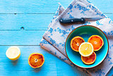 Colorful Orange fruits over a light blue painted wood table