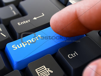 Pressing Blue Button Support on Black Keyboard.