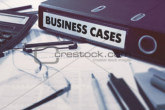Business Cases on Ring Binder. Blured, Toned Image.