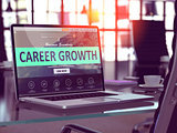 Career Growth on Laptop in Modern Workplace Background.