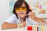 Young pupil conducting a simple chemical experiment