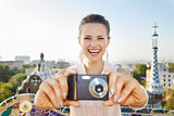Woman tourist taking photo with photo camera in Park Guell