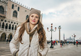 Woman tourist on St. Mark's Square near Dogi Palace, Venice