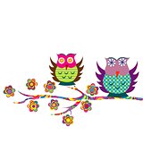 Patterned cartoon owls on a branch