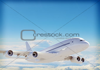 Passenger jet plane flies above the clouds