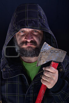 Hooded tough guy holding axe