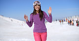 Happy young woman at a ski resort