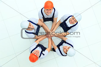 Large group of workers standing in circle