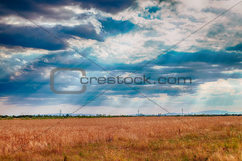 dramatic blue sky with clouds and sun rays