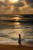 Girl on a beach on sunset