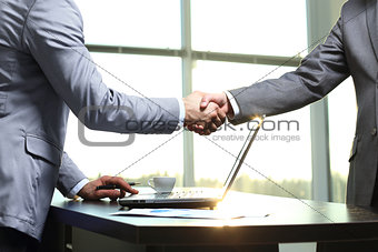 Business handshake. Morning at the office