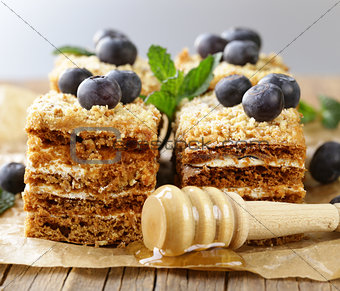 homemade honey cake with blueberries and mint