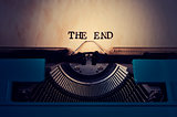 retro typewriter and text the end