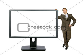 Businessman near big monitor with blank screen