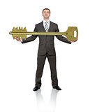 Businessman holding big gold key
