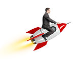 Businessman riding red rocket