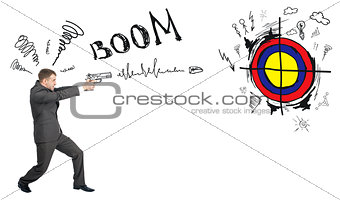 Businessman shooting from gun