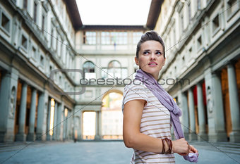 Young woman tourist enjoying attractions of Florence, Italy