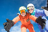 Picture of two snowboarders having fun on the top of Dolomiti Alps