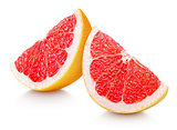 Slices of grapefruit citrus fruit isolated on white