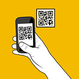 Hand with smartphone taking a QR code