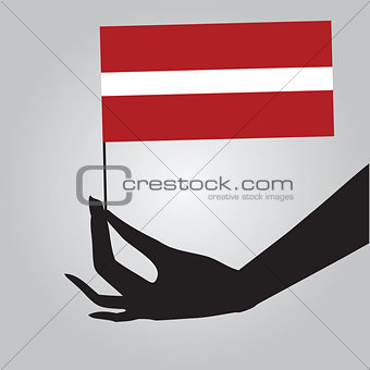 Hand with flag Latvia