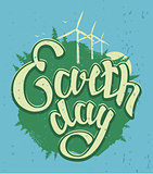 April 22 Earth Day. Green Earth and wind energy. Earth Day lettering text