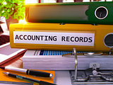 Accounting Records on Yellow Ring Binder. Blurred, Toned Image.