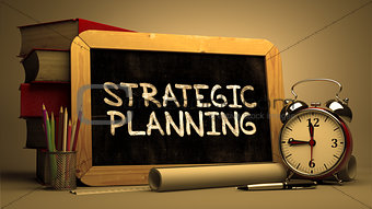 Strategic Planning - Chalkboard with Hand Drawn Text.