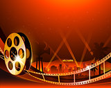 Illustration of a film stripe reel on shiny red movie background