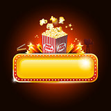 Golden movie theater banner sign with pop corn and copy space