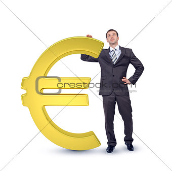 Businessman near big euro sign