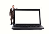 Businessman near big laptop with blank screen