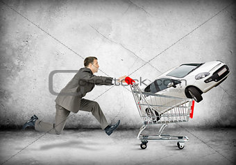Businessman pushing shopping cart
