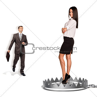 Businessman with woman in bear trap
