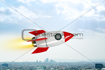 Space rocket flying above city