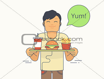 Happy guy holds a tray with big hamburger, french fries and milkshake
