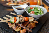 Assorted meat on skewers in  restaurant