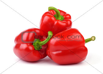 Three red sweet peppers.
