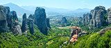 Meteora rocky monasteries summer panorama.