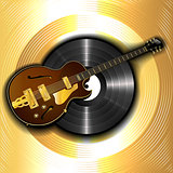 jazz guitar and a vinyl disc on a background of gold
