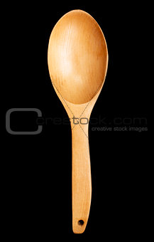 Wooden spoon on black