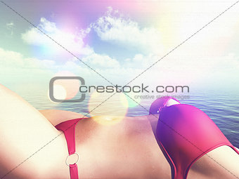Close up of a 3D female figure in a bikini sunbathing