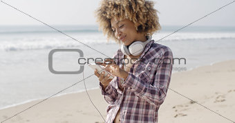 Girl On Beach Listening To Music