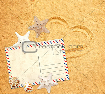 Retro pastcard, starfish and shells on sand texture