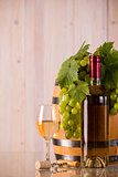 Glass of wine with grapes and leaves